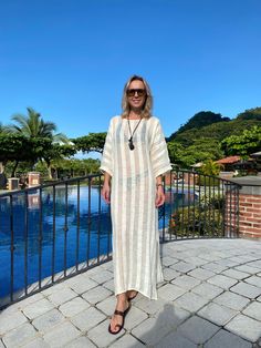 Evoke your inner goddess in our delightful Athena Kaftan. Perfect for an island resort vacation, this breezy linen kaftan will be a great cover-up solution if you want to throw something on top of your bikini. Or wear it over a slip dress, over shorts, even jeans. Athena Kaftan is one size. Due to its breathable transparency, you can purchase it together with our Leah cotton slip dress, that is available in sizes S, M, L. And then it can be worn as a maxi linen dress. Belt it up, if you like, an Chic White Maxi Length Cover-up, Oversized White Cover-up For Loungewear, White Flowy Cover-up For Vacation, White Cover-up For Beach Season, Beige Long Sleeve Tunic For Vacation, Flowy White Breezy Cover-up, White Free Size Cover-up For Beach Party, White Beachwear Cover-up, White Free Size Beach Party Cover-up