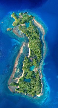 an island in the middle of blue water