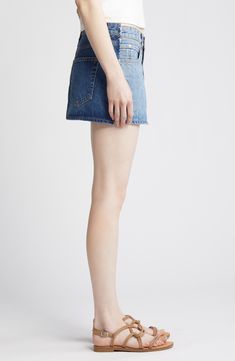 Channel a modern DIY vibe in this two-tone miniskirt cut from two panels of Italian organic-cotton nonstretch denim and designed with raw hems. 12 1/4" center front length (size 29) Zip fly with button closure Five-pocket style 100% organic cotton Machine wash, tumble dry Made in USA of imported fabric Denim Blue Cotton Cutoff Mini Skirt, Modern Mini Bottoms For Summer, Cutoff Cotton Skort With Frayed Hem, Cotton Cutoff Skort With Frayed Hem, Modern Mini-length Summer Bottoms, Modern Mini Length Bottoms For Summer, Trendy Dark Wash Cutoff Skort, Denim Mini Skort With Frayed Hem, Cotton Denim Skirt With Frayed Hem