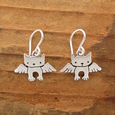 A very sweet tribute for your cat. They are 1/2 of an inch tall and handmade using solid sterling silver with solid sterling French ear wires. These will make you smile through those hard days. For the large matching necklace: https://www.etsy.com/listing/106961895/angel-kitty-necklace For the small matching necklace: https://www.etsy.com/listing/106971983/tiny-angel-kitty-necklace For the mother-daughter set: https://www.etsy.com/listing/106580243/mother-daughter-angel-cat-set Items are shipped Whimsical Sterling Silver Earrings, Whimsical Sterling Silver Hypoallergenic Jewelry, Cute Sterling Silver Earrings With Ear Wire, Nickel-free Cat Ears Jewelry For Gifts, Nickel-free Cat Ears Jewelry Gift, Whimsical Sterling Silver Dangle Earrings, Cute Sterling Silver Dangle Earrings, Nickel-free Cat Ears Earrings As Gift, Sterling Silver Cat Ears Earrings