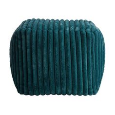 a blue velvet ottoman with pleated edges on an isolated white background for use in interior and exterior design