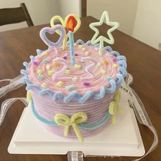 a birthday cake with icing and decorations on it