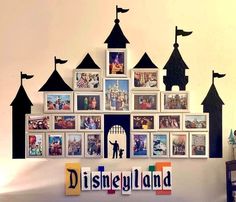 there is a castle with pictures on it and the name disneyland land spelled out in letters