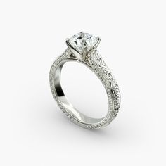 a diamond engagement ring with filigrees on the sides