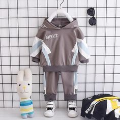 2-piece Color-block Hoodie & Pants for Children Boy - PrettyKid Long Sleeve Patchwork Sets For Spring, White Long Sleeve Patchwork Sets, Spring Cotton Sets With Patchwork Details, Cotton Patchwork Sets For Spring, Spring Cotton Sets With Patchwork, Gray Stretch Sets With Long Sleeves, Spring Cotton Patchwork Sets, Hooded Cotton Sets For Spring, Spring Cotton Hooded Set