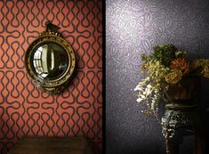 the wall paper in this room is red and purple with an intricate pattern on it