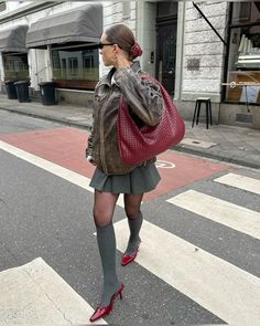 leather jacket brown washed red bottega bag socks red miu miu heels outfit sleek bun fashion style Bottega Bag, Burgundy Bag, Burgundy Heels, Socks And Heels