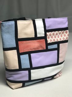 a purse with different colored squares on it