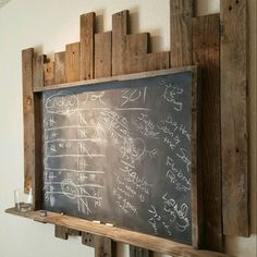 a blackboard with writing on it in a room