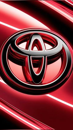 the front end of a red toyota logo on a shiny metal background greeting card by jorgom photography