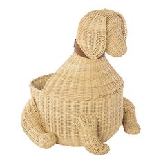 a dog shaped wicker basket sitting on the ground