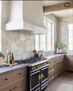 a stove top oven sitting inside of a kitchen