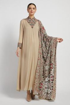 Beige long kurta with placement thread worked motifs, front inverted pleat and cuff sleeves. Comes with churidar and embellished dupatta.
Component: 3
Embroidered
Neckline: Mandarin Collar
Sleeve Length: Full
Fabric: Georgette
Color: Beige
Keyhole neck
Inverted pleat
Cuff sleeves - Aza Fashions Kurta Set With Dupatta, Beige Kurta, Long Kurta, Kurta Set For Women, Long Kurti Designs, Dress Neck Designs, Keyhole Neck, Chaniya Choli, Embroidered Neckline