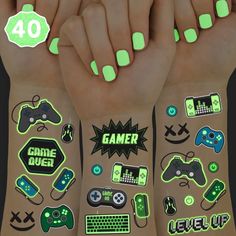 glow in the dark nail stickers on both hands and fingers with game over written on them