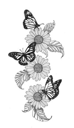 three butterflies flying over some flowers