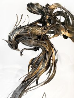 a metal sculpture is shown against a white background