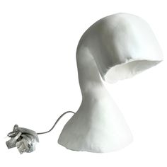 a white lamp with a cord attached to it