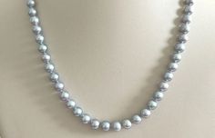 7mm AAA Round Chinese Akoya Silver Grey Pearls and 14K White Gold Clasp Gray Round Pearl Jewelry, Gray Pearl Necklace For Formal Occasions, Gray Round Necklace For Formal Occasions, Formal Gray Pearl Necklace, Gray Single Strand Jewelry With Round Beads, Gray Single Strand Pearl Necklace As Gift, Gray Single Strand Round Bead Jewelry, Elegant Gray Round Pearl Necklace, Classic Gray Jewelry For Formal Occasions