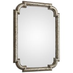 an ornate silver framed mirror on a white background