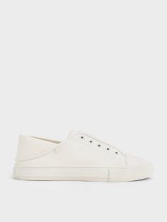 White sneakers will never go out of style. This pair of slip-on sneakers is a refreshing take on the iconic shoe style. Featuring a convenient no-lace elastic closure, they are a breeze to put on and take off. Versatile enough to be dressed up and down with ease, they will look just as good with your favourite jeans as with a flowy maxi dress. White Slip On Sneakers, Flowy Maxi Dress, White Slip, Charles Keith, Shoe Style, Slip On Sneakers, White Sneakers, Go Out, Sneakers White