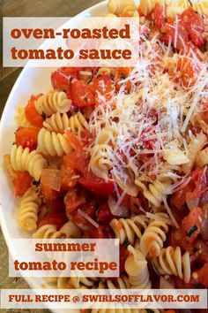 a white plate topped with pasta covered in tomato sauce