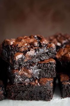 chocolate brownies stacked on top of each other