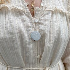 An adult-size plain polished sterling silver round locket on a rope chain necklace. Locket Dimensions: 33 mm Chain Length: 27" Round Locket Necklace, Necklace Locket, Round Locket, Rope Chain Necklace, Locket Necklace, Rope Chain, Chain Lengths, Chain Length, Locket