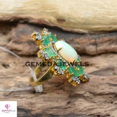 Sale! Genuine Opal Gemstone Ring, Pave Diamond Jewelry, Emerald Gemstone Ring, 925 Silver Gold Vermeil Jewelry, Beautiful Ring, Gift For her Gross Weight: 13.29 gram Gemstone Weight: 10.51 cts Diamond Weight: 1.30 cts Ring Size: 38X33 MM NOTE:- All The Products Are Designed And Manufactured In My Workshop By Me & My Team. Shown Products Are Purely Handmade. Custom Orders Are Open Handly Accepted. We Are the Perfect Choice For Any Custom Jewelry Manufacturing. For Bulk Orders Please Message m Oval Emerald Ring Fine Jewelry, Opal Ring With Diamond Gemstone Accents, Diamond Gemstones With Stone Setting For Anniversary, Fine Jewelry Gemstones With Stone Setting For Wedding, Fine Jewelry Wedding Gemstones With Stone Setting, Oval Emerald Ring With Stones For Wedding, Oval Emerald Ring For Wedding, Anniversary Opal Ring With Gemstone Accents In Sterling Silver, Anniversary Sterling Silver Opal Ring With Gemstone Accents