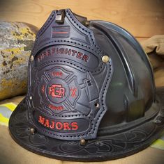 a firefighter's helmet sitting on top of a table