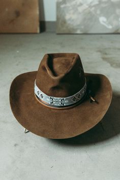 Western 100x in Whiskey with custom distressing and hand shaping 3 1/2" brim Elk leather accent band Hand stitched Mountain detail West hat band sold separately. This felt hat is made to order, please allow 6-8 weeks for delivery. Western Felt Hats, Distressed Brown Hats With Short Brim For Country Events, Distressed Brown Fedora For Country Events, Rustic Distressed Brown Hat With Curved Brim, Rustic Hat With Curved Brim In Distressed Brown, Rustic Fitted Hat For Western-themed Events, Rustic Hat With Distressed Brown Curved Brim, Rustic Hat With Distressed Brown Color And Curved Brim, Rustic Distressed Brown Brimmed Hat