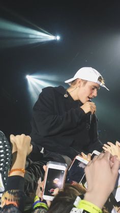 a man sitting on top of a crowd of people