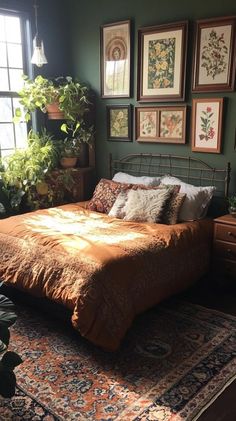 a bed sitting in a bedroom next to a window with potted plants on it