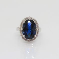 Vintage Sterling Silver Oval Blue Sapphire & White Topaz Ring...Marked 925...Total of weights 5.6grams... Size 6...Measure of Face 18.3MM...It's in very good condition. Oval Blue Cubic Zirconia Sapphire Ring, Oval Blue Cubic Zirconia Ring, Blue Cubic Zirconia Rings With Oval Shape, Blue Sapphire Oval Crystal Ring, Fine Jewelry Oval Sapphire Ring With Stone Setting, Oval Blue Sapphire Crystal Ring, Formal Oval Topaz Ring With Stone Setting, Oval Sapphire Ring With Stone Setting, Blue Oval Sapphire Ring With Stone Setting