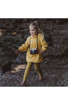 Cozy microfleece lining keeps your kiddo warm while a waterproof and windproof shell made from recycled polyester handles the rest in this super cool raincoat. Waterproof   PFC-free, durable water-repellent coating is free of per- and poly-fluorinated chemicals, some of which can be harmful to the environment   100% recycled polyester with 100% polyester lining   Machine wash, line dry   Imported Playful Waterproof Raincoat For Rainy Weather, Playful Raincoat For Rainy Season, Winter Adventure Hooded Raincoat, Hooded Winter Adventure Raincoat, Waterproof Hooded Adventure Raincoat, Playful Winter Raincoat For Outdoor Use, Playful Winter Windbreaker For Outdoor, Playful Winter Raincoat For Rainy Weather, Playful Long Sleeve Raincoat For Outdoor