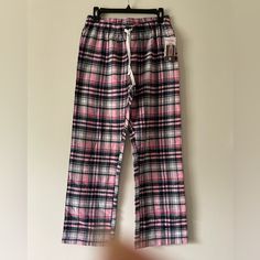 Carnival Women’s Lounge Pants. These Women’s Lounge Pants Are Pink, Black And White Plaid With A Draw String. Excellent For Lounging Around The House. Pink Pajamas With Pockets, Pink Lounging Bottoms With Pockets, Pink Bottoms With Elastic Waistband For Sleepover, Pink Sleep Bottoms Long Pants, Pink Sleepover Pants With Elastic Waistband, Pink Pants With Elastic Waistband For Sleepover, Pink Trousers For Pajama Party, Pink Long Pants For Sleepover, Pink Long Pants For Sleepovers