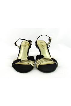 Style these strappy gold & black sandals with any evening dress. Made with a small heel, you will be able to dance the night away in these fabulous shoes. Size 7.5 B Leather & fabric upper Leather sole Gold-tone buckle Strappy style Open toe Light outsole wear Mark on interior lining Heel height 3.5" Gold Sandals, Fabulous Shoes, Shoes Size 7, Nicole Miller, Stylish Shoes, Leather Fabric, Gold Black, Black Sandals, Evening Dress