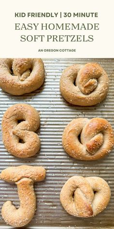 homemade soft pretzels on a baking sheet with text overlay reading kid friendly 30 minute easy homemade soft pretzels an oregon cottage