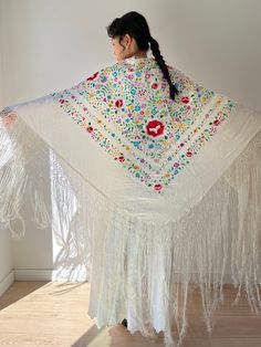 Dating from the 1920s a fine, ivory white embroidered silk 'piano' shawl with an abundance of hand embroidered flowers. measurement(cm): 125 X 135cm + 30cm silk fringe. The model wears clothing size S, 36 and 1,66 cm tall. All numbers are measured on the flat garment. For comparison, it is best to measure a similar piece of clothing in your closet condition: good antique condition material: silk NOTE Please leave your phone number because the domestic delivery office asks for it. For shop update Antique Piano, Piano Shawl, Starting Small Business, Fringe Shawl, Hand Embroidered Flowers, Japanese Silk, Gift Of Time, Ivory Silk, Embroidered Silk