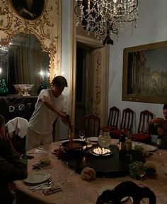 a group of people sitting around a dining room table