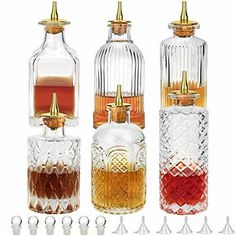 four different types of liquor bottles with gold caps on each one and the other side