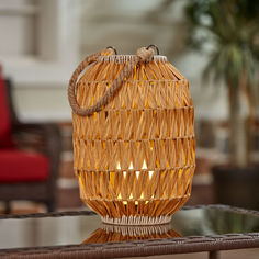 a wicker bag sitting on top of a glass table