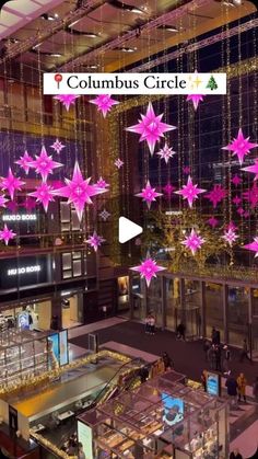 the atrium at columbus circle is decorated with pink stars