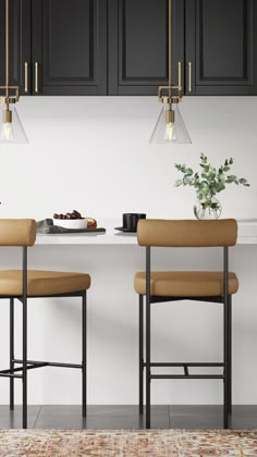 two brown stools sitting in front of a kitchen counter