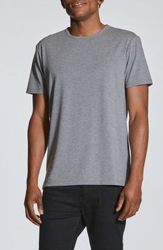 Elevated with a split hem and buttery-soft cotton blend, this classic T-shirt brings wearable versatility to an unforgettable closet essential. Crewneck Short sleeves 62% polyester, 33% cotton, 5% spandex Machine wash, dry flat Imported Heather Grey Cotton Crew Neck T-shirt, Gray Boxy Cotton T-shirt, Gray Relaxed Fit V-neck T-shirt, Essential Crewneck, Heather Grey Long Sleeve Relaxed Fit T-shirt, Gray Stretch Breathable T-shirt, Closet Essentials, Split Hem, Heather Grey