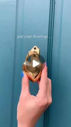 a woman's hand holding onto a door knob with the words put your heart on it