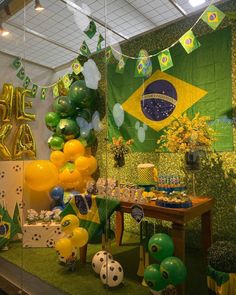 a room filled with balloons and decorations for a soccer themed birthday or baby's first birthday