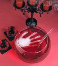 a glass bowl filled with liquid sitting on top of a table