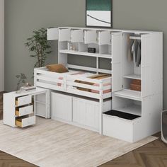 a white bunk bed with drawers underneath it