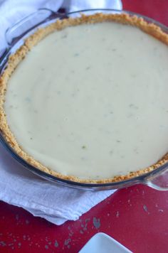 a pie sitting on top of a red table