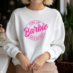 A premium unisex white crewneck featuring BARBIE Sizes: Small - XXXL (Order the size you would normally wear on a standard sweatshirt and hoodie) ❀ Production and Shipping All orders are made to order and ship within a couple of days from Ontario. ❀ Care Instructions Wash inside out, gentle cycle, cold water, tumble dry low. Do not iron directly on the design. ❀ Returns Of Items All items are made-to-order. We cannot accept returns Please reach out if you have any questions.  ❀ If you or your company is looking for custom apparel more that 25 pieces, please reach out as we can help! White Crewneck, Custom Apparel, Crewneck Sweater, Custom Clothes, Crew Neck Sweater, Ontario, Sweat Shirt, Cold Water, Inside Out